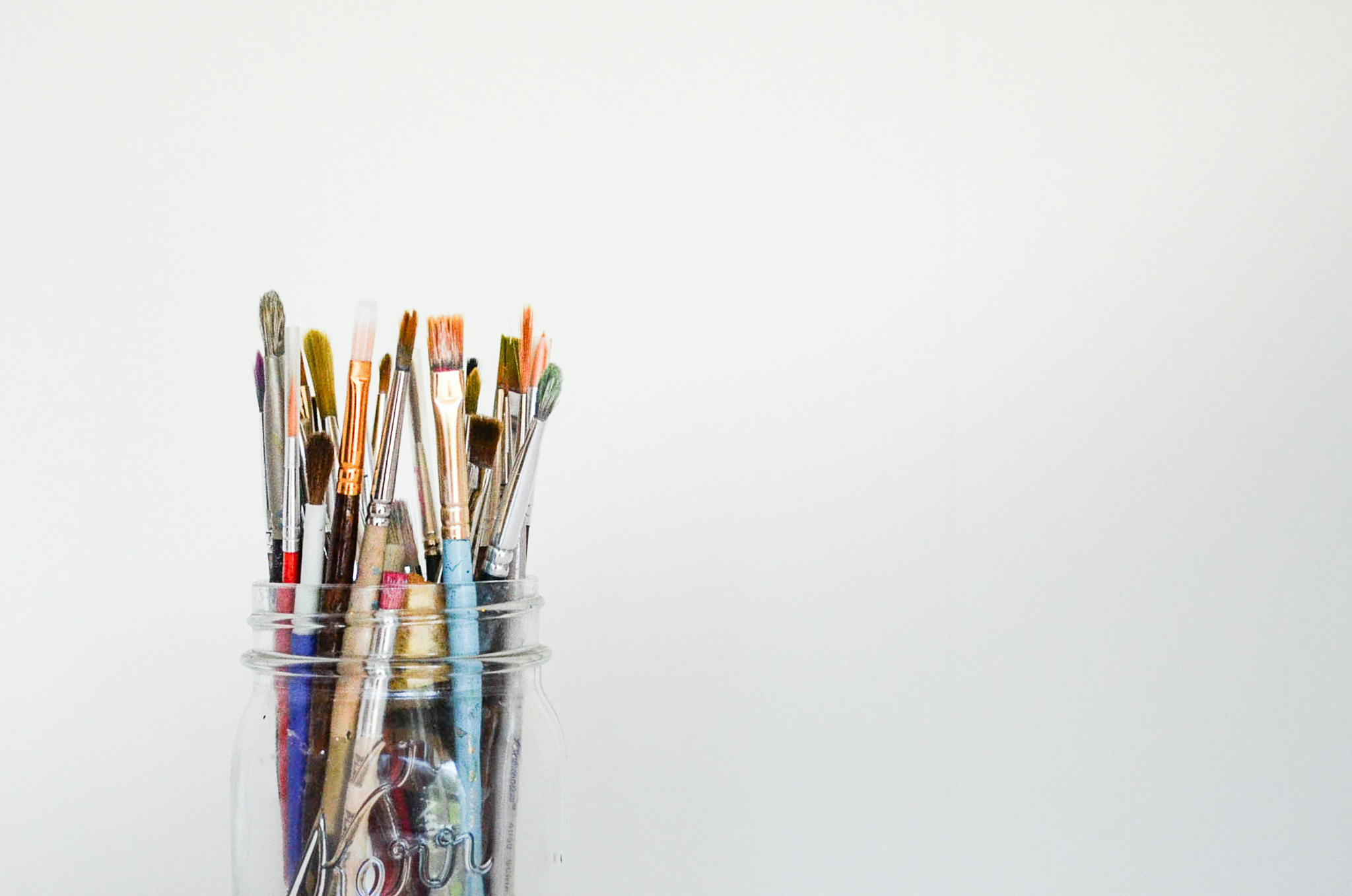 paint brushes in a jar